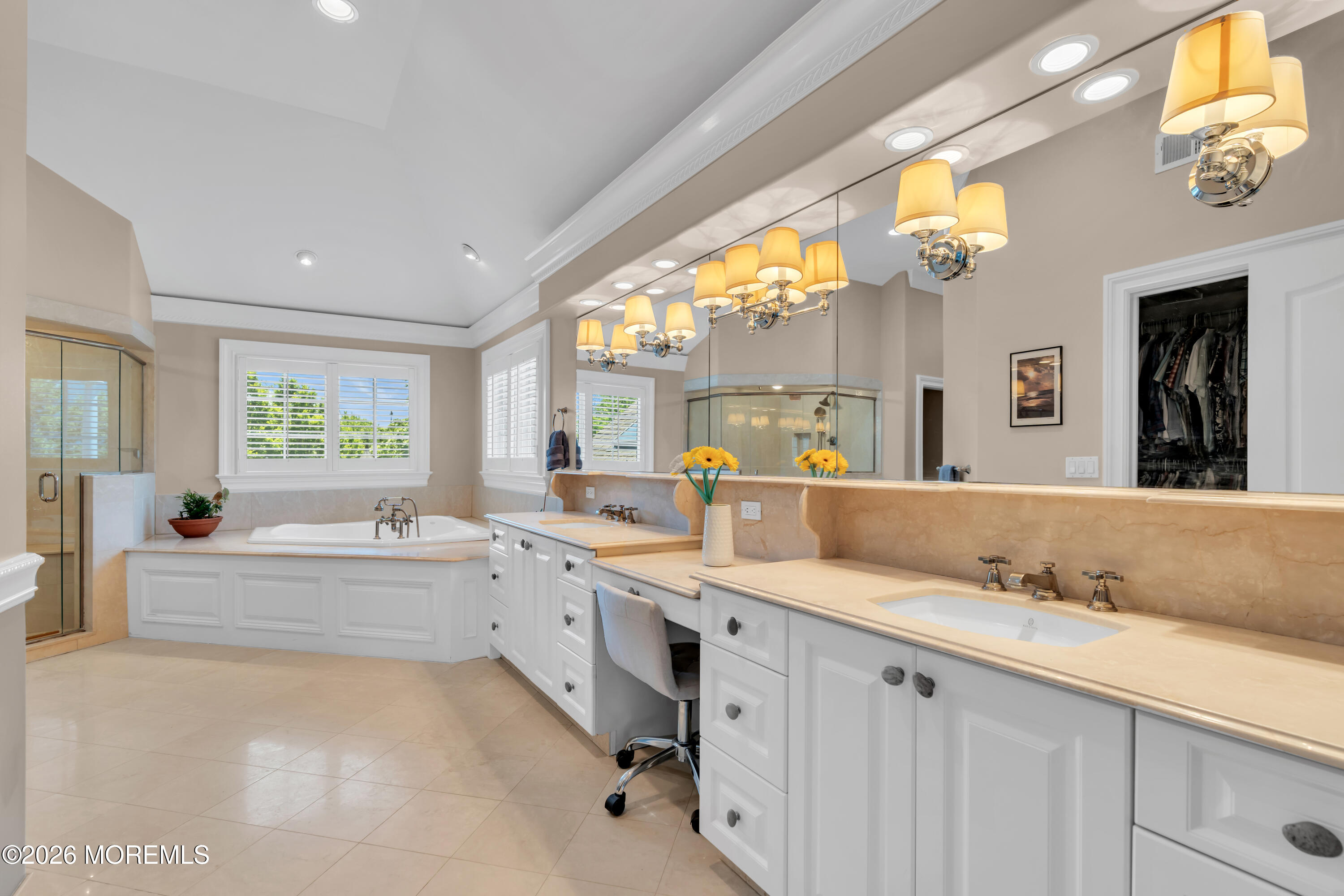 600 Little Silver Point Road Little Silver, NJ 07739 - Photo 35 of 55 a spacious bathroom with a granite countertop sink mirror and a bathtub