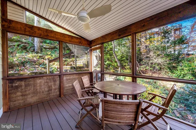 an aerial view of a house with a lake view