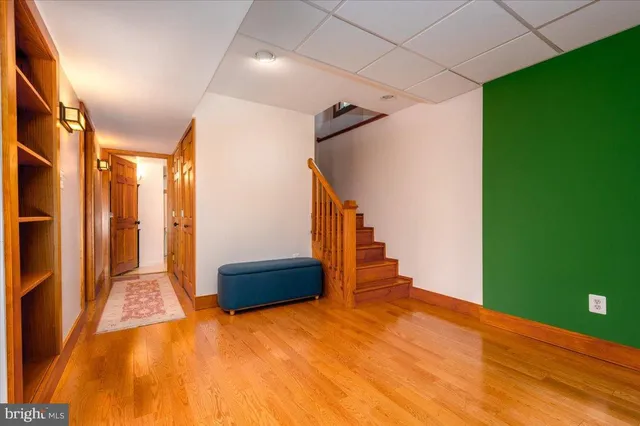 a living room with furniture large window and a flat screen tv