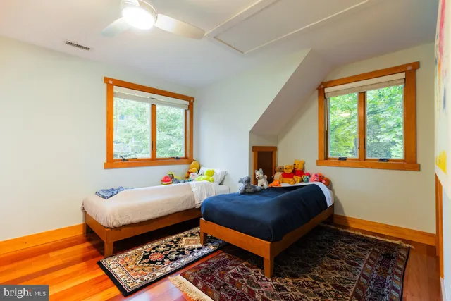 a view of a lake with boats and trees in the background