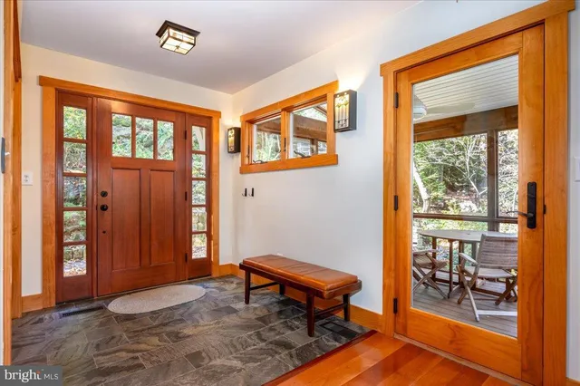 a view of a workspace with furniture and entryway