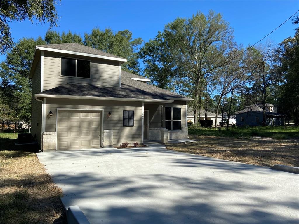 15860 Pecan Drive Montgomery, TX 77356 - Photo 1 of 23 a front view of a house with a yard