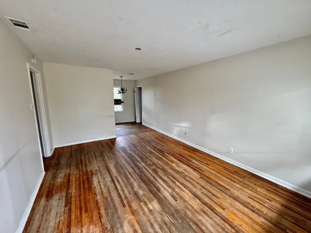 a view of wooden floor in an empty room