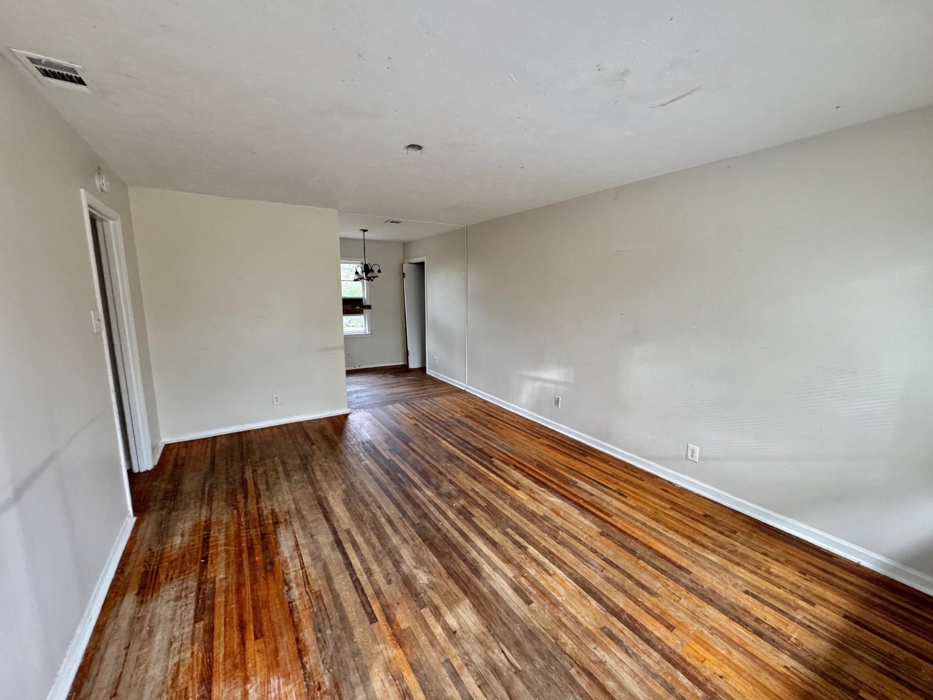 4967 Newton Road Memphis, TN 38109 - Photo 3 of 12 a view of wooden floor in an empty room