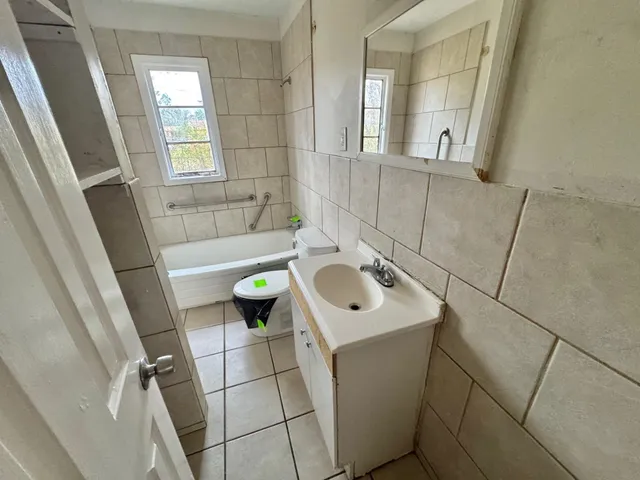 a bathroom with a sink and toilet