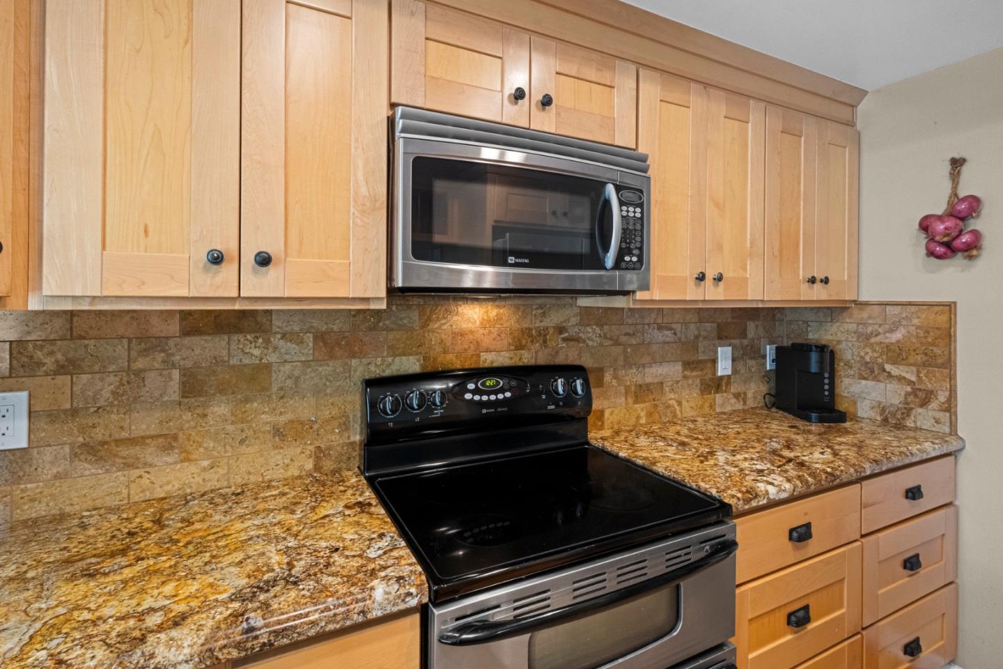 2137 Darnis Circle Morgan Hill, CA 95037 - Photo 11 of 66 a kitchen with granite countertop white cabinets stainless steel appliances and a sink