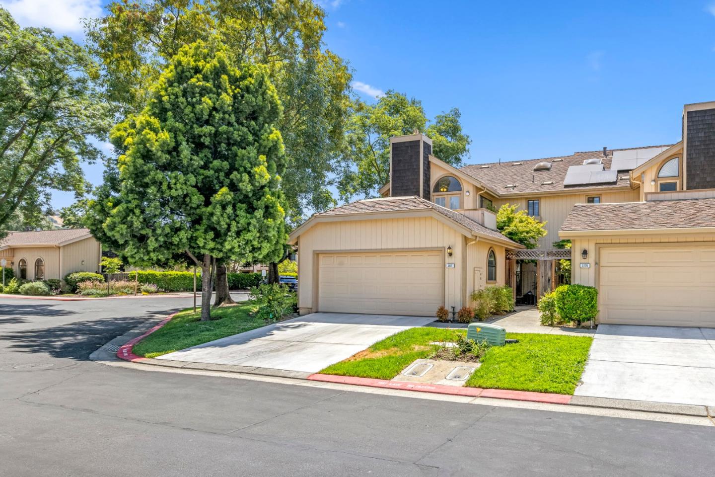2137 Darnis Circle Morgan Hill, CA 95037 - Photo 5 of 66 a front view of a house with a yard and garage