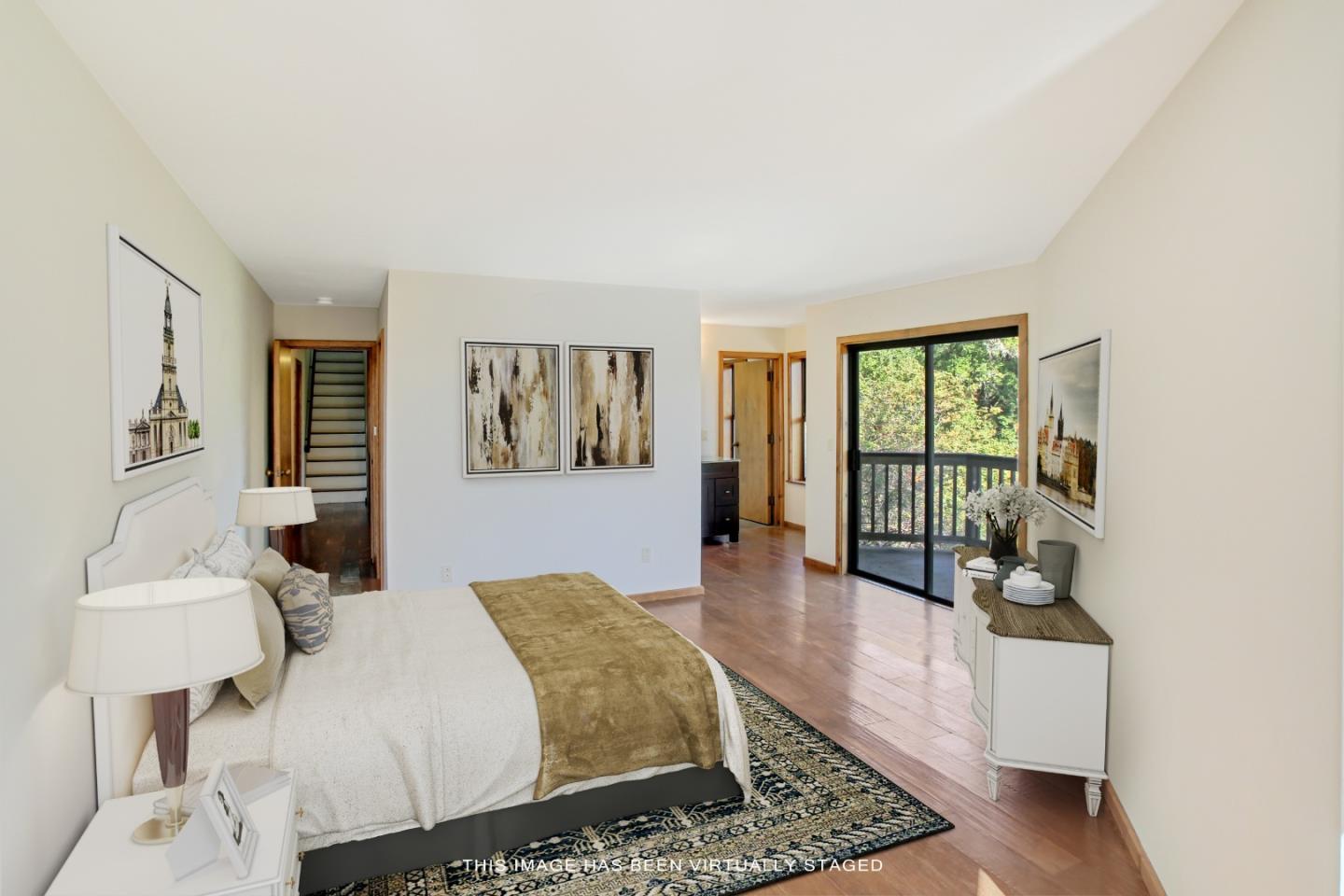 223 Rapley Ranch Road Redwood City, CA 94062 - Photo 8 of 42 a spacious bedroom with a bed a couch and large window