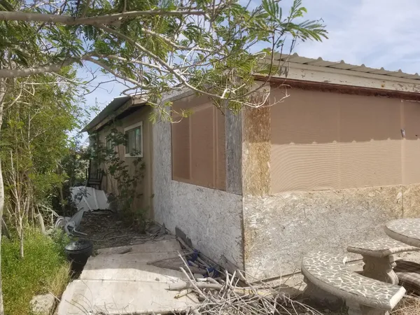 a view of a balcony dining table and chairs