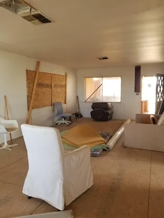 a living room with furniture and a rug