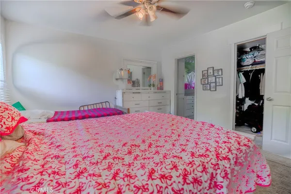 a bedroom with a bed and a closet