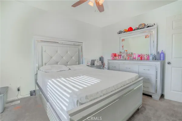 a bedroom with a bed and closet