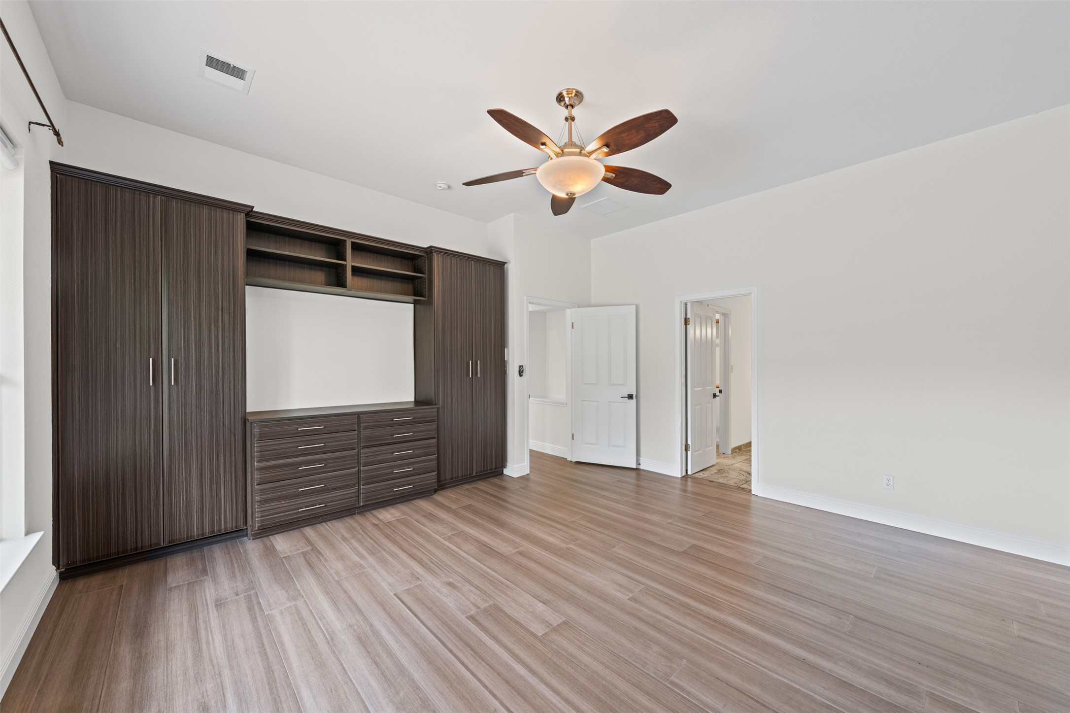 8820 Colberg Drive Austin, TX 78749 - Photo 15 of 35 Built-in cabinetry offers ample storage and modern convenience in this open space.