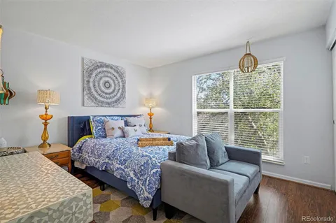 a bedroom with a bed and a couch
