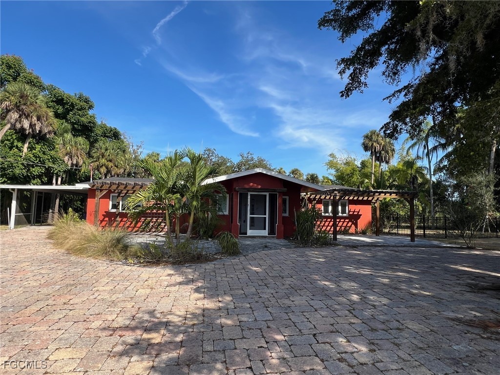 13191 Idylwild Farm Road Fort Myers, FL 33905 - Photo 1 of 21 a view of a house with a yard
