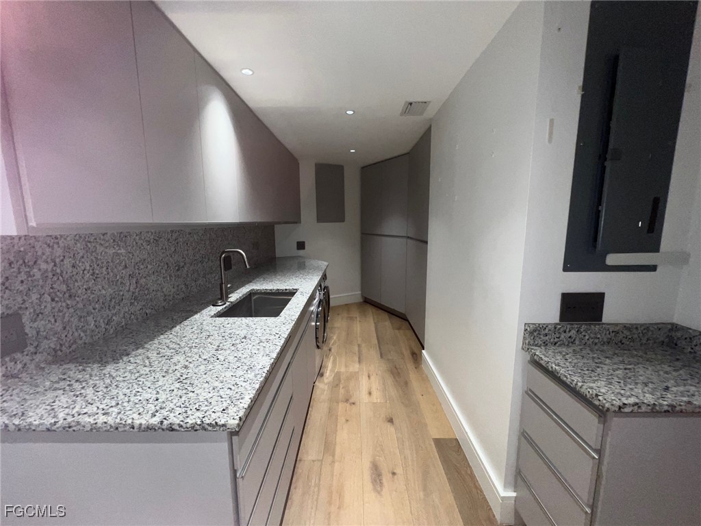 13191 Idylwild Farm Road Fort Myers, FL 33905 - Photo 11 of 21 a kitchen with a sink and a refrigerator