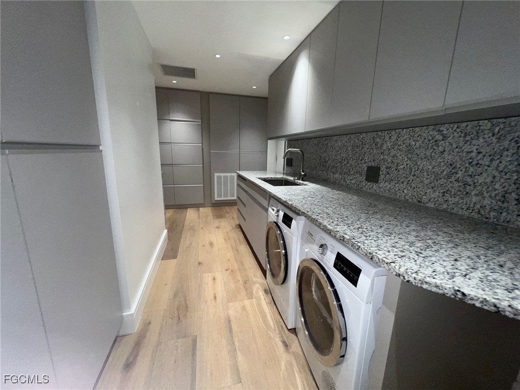 13191 Idylwild Farm Road Fort Myers, FL 33905 - Photo 12 of 21 a utility room with washer and dryer
