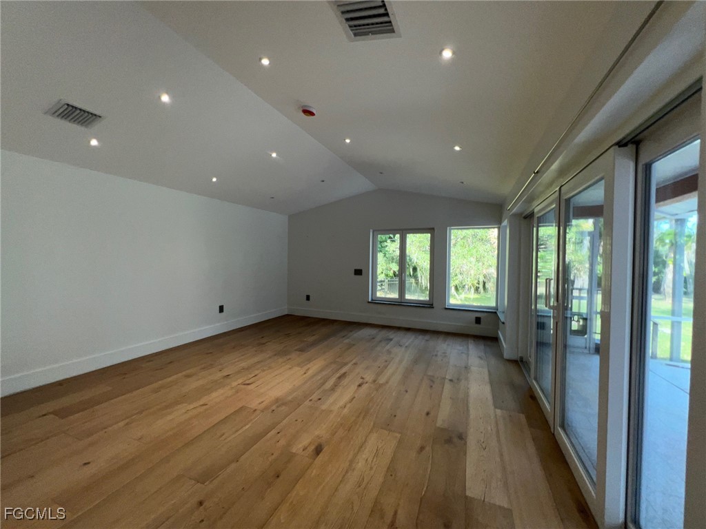 13191 Idylwild Farm Road Fort Myers, FL 33905 - Photo 13 of 21 a view of a room with wooden floor and windows