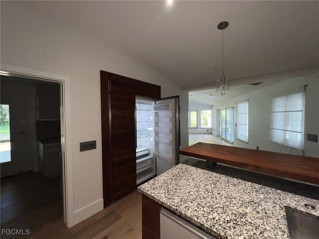 13191 Idylwild Farm Road Fort Myers, FL 33905 - Photo 20 of 21 a kitchen with sink and refrigerator