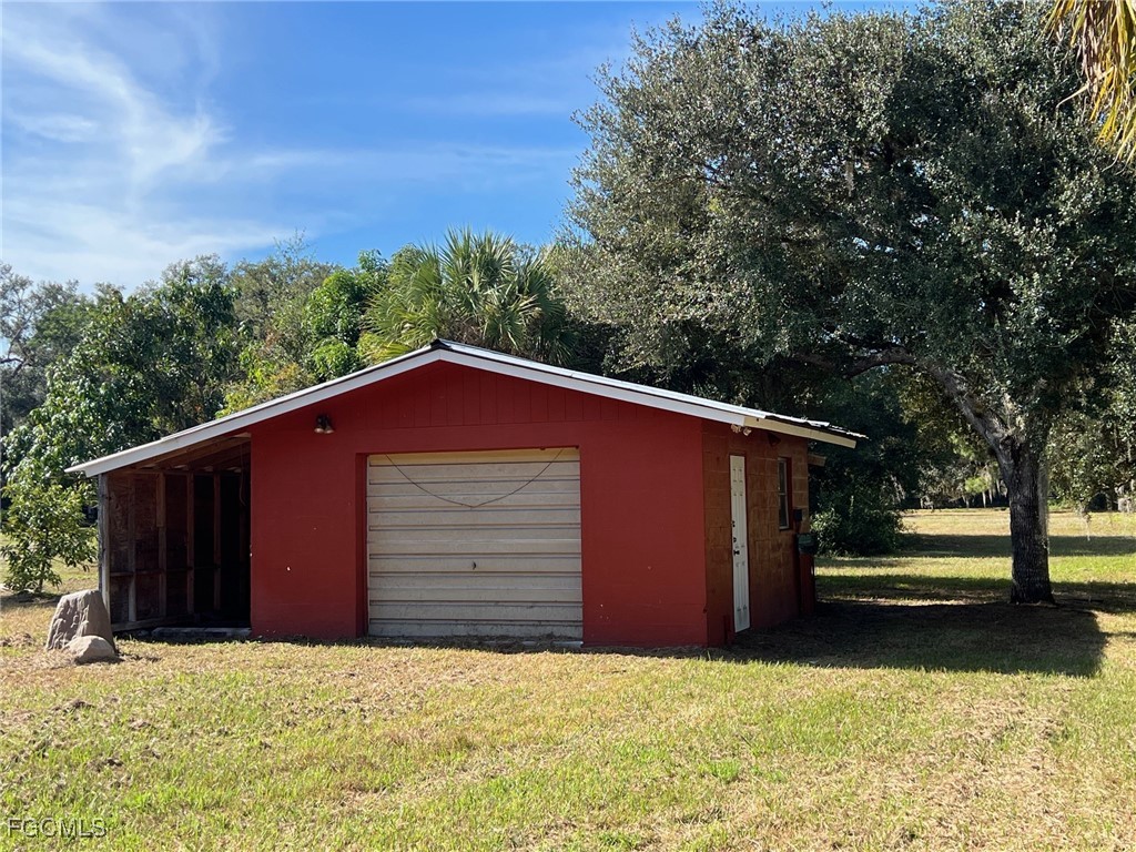 13191 Idylwild Farm Road Fort Myers, FL 33905 - Photo 21 of 21 a view of a house with a yard