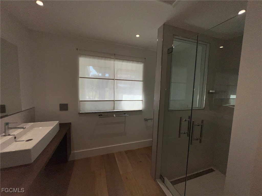 13191 Idylwild Farm Road Fort Myers, FL 33905 - Photo 7 of 21 a bathroom with a sink and a mirror