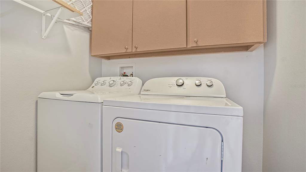 105 Caterham Way Kissimmee, FL 34758 - Photo 32 of 34 a utility room with dryer and washer