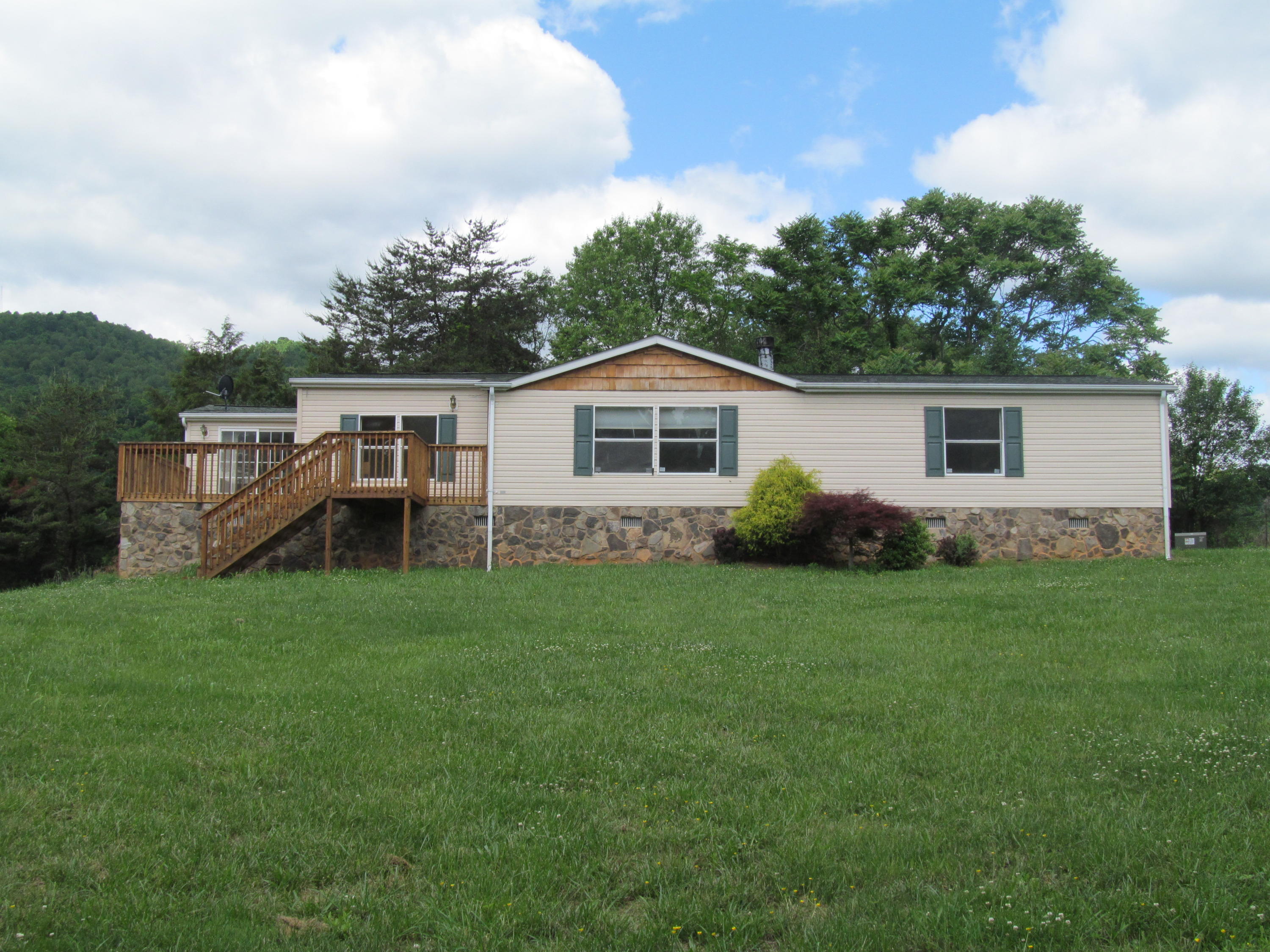 3016 Quarles Road Thaxton, VA 24174 - Photo 1 of 41 a view of a house with backyard and garden