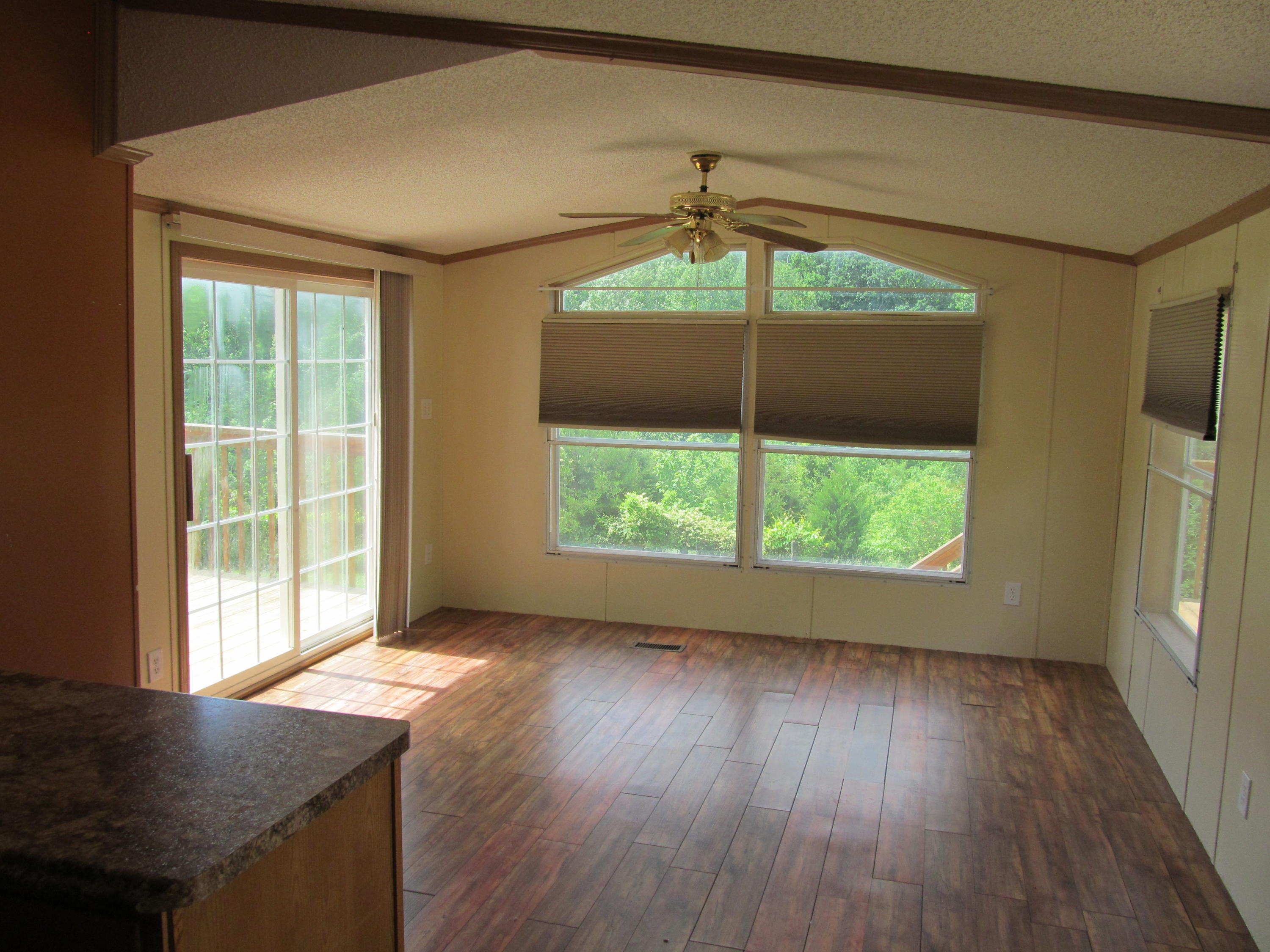 3016 Quarles Road Thaxton, VA 24174 - Photo 2 of 41 an empty room with wooden floor and a window
