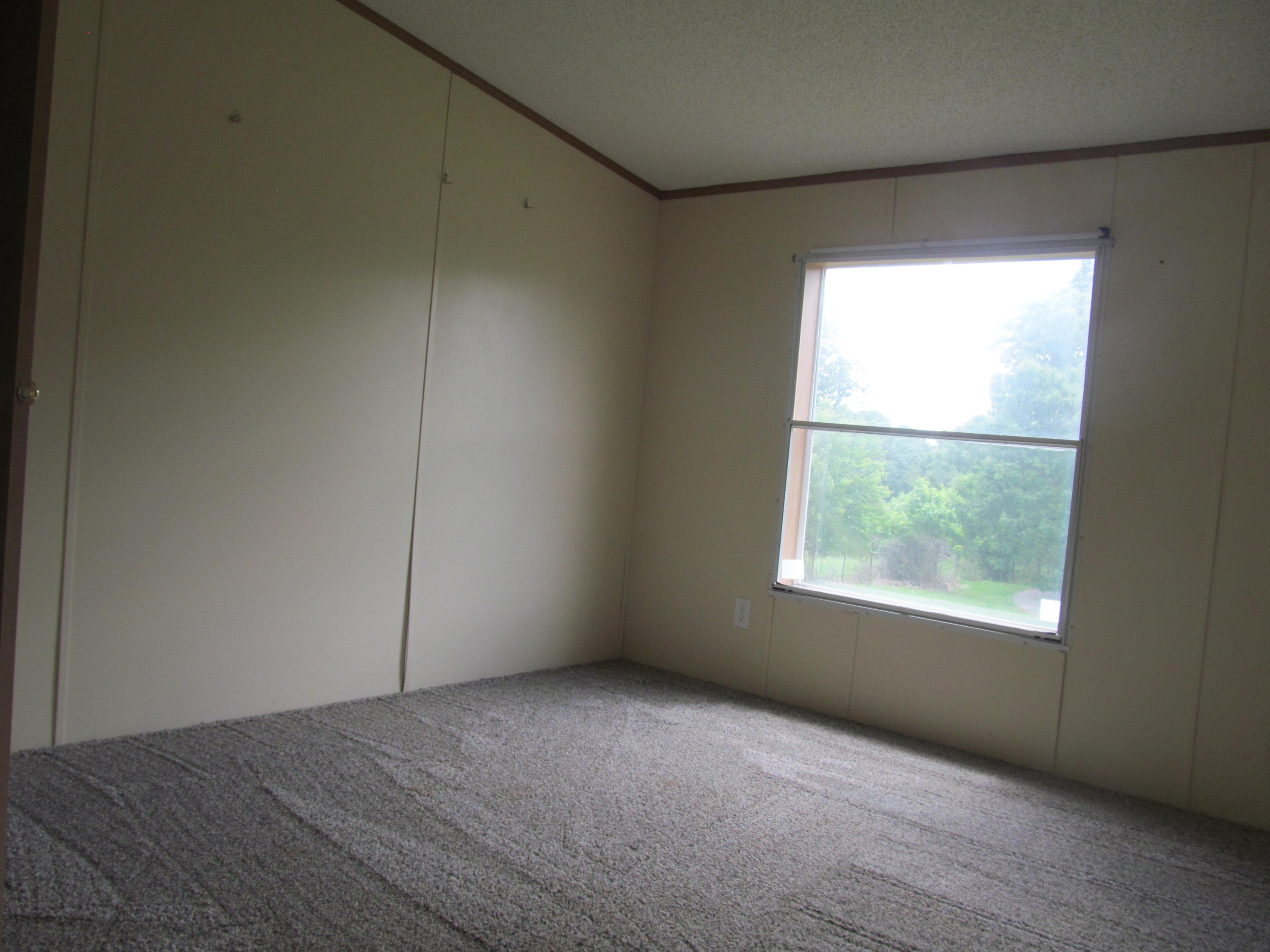 3016 Quarles Road Thaxton, VA 24174 - Photo 12 of 41 an empty room with a window