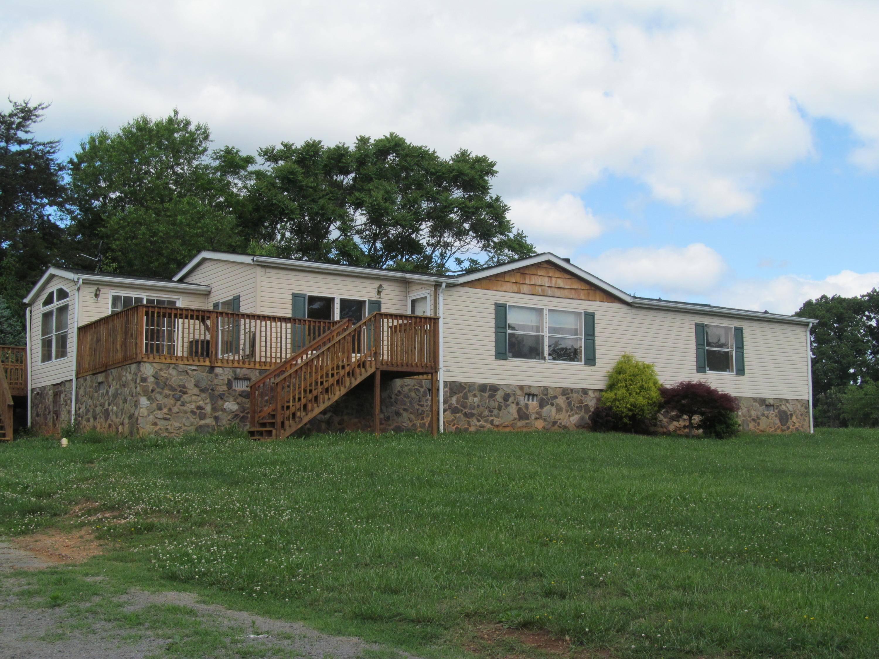 3016 Quarles Road Thaxton, VA 24174 - Photo 18 of 41 a view of a house with a yard and deck