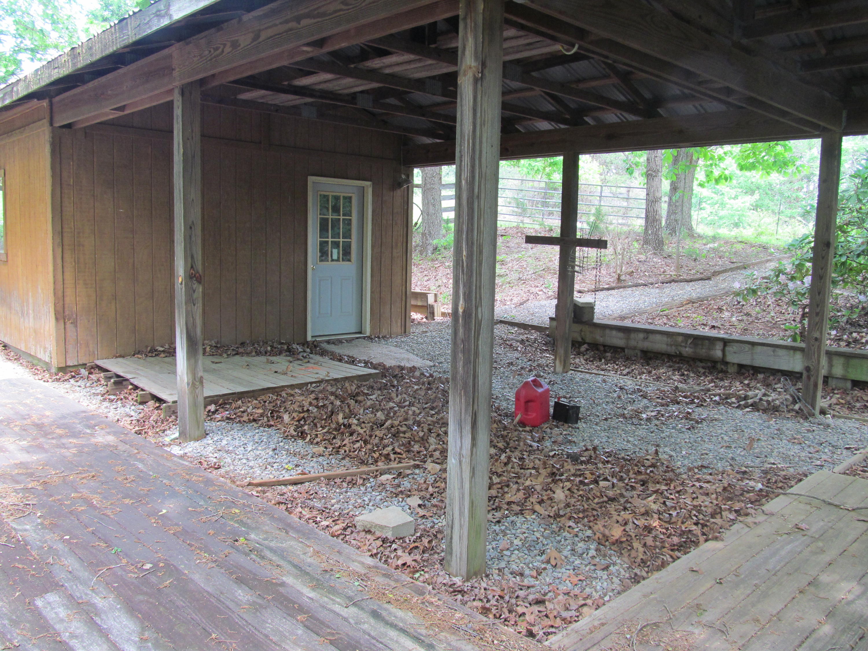 3016 Quarles Road Thaxton, VA 24174 - Photo 31 of 41 a view of a porch with a table and chairs under an umbrella