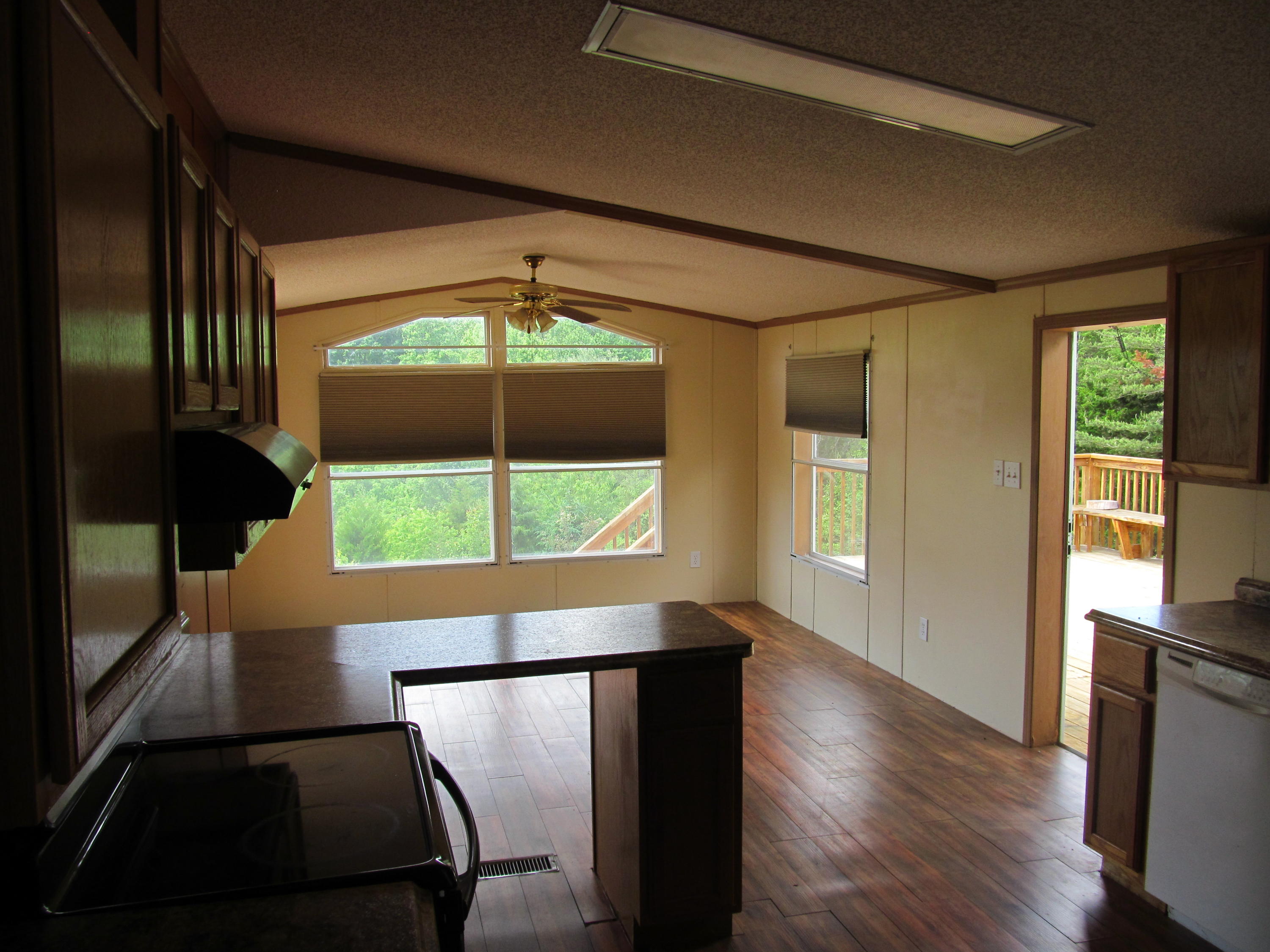 3016 Quarles Road Thaxton, VA 24174 - Photo 5 of 41 a view of an empty room with wooden floor and a window
