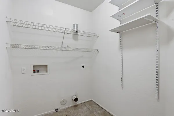 a spacious bathroom with a granite countertop sink mirror and a bathtub