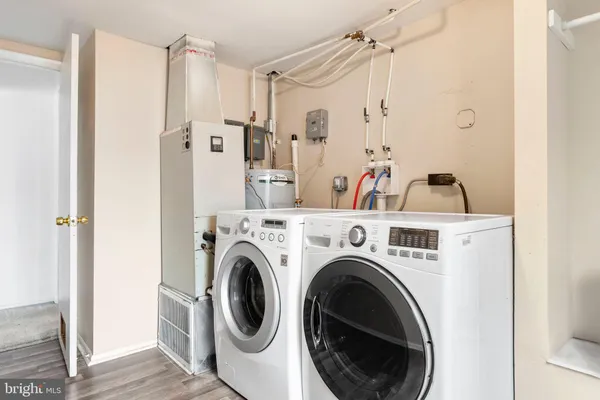 a view of a kitchen with washer and dryer