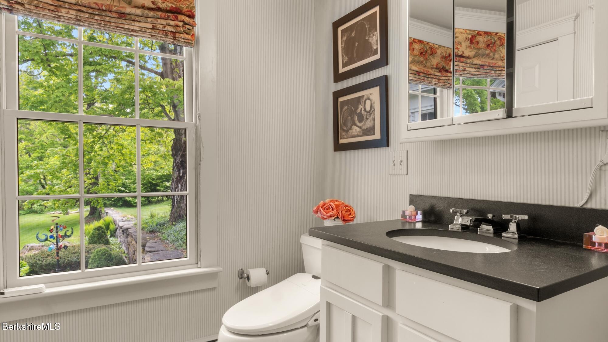 2650 Swamp Road Richmond, MA 01254 - Photo 39 of 49 a bathroom with a granite countertop sink and a window