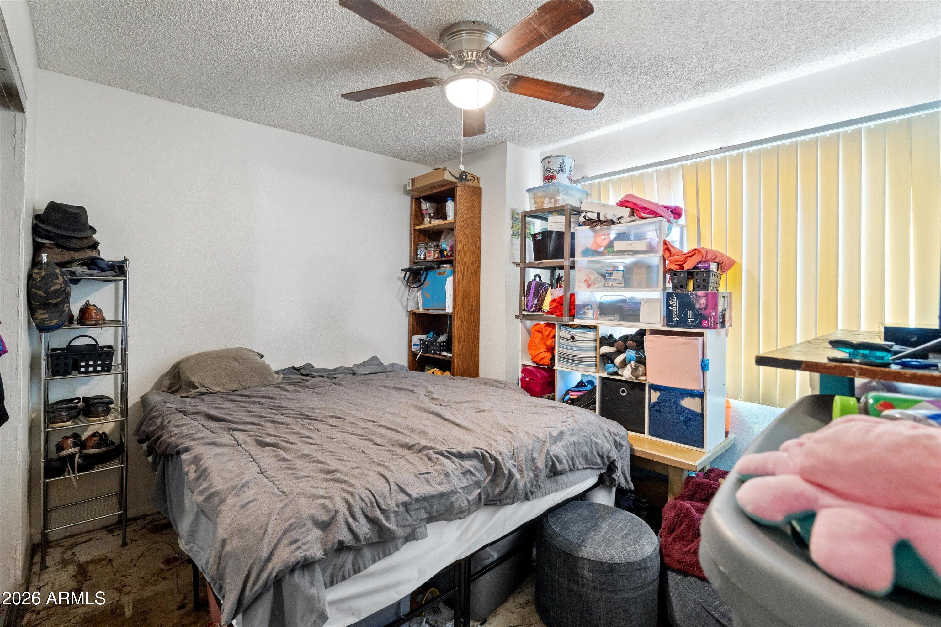600 South Dobson Road, Unit 88 Mesa, AZ 85202 - Photo 15 of 18 a bedroom with a bed and a closet