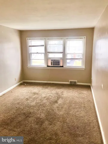 an empty room with a natural light