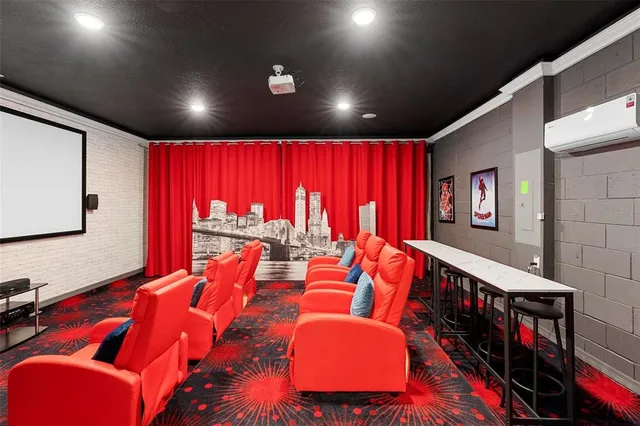a living room with blue lights with furniture and a projector