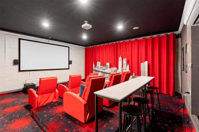 a living room with furniture a large window and a flat screen tv