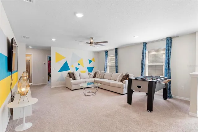 a living room with furniture and a table