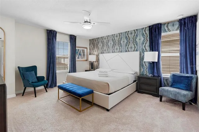 a bedroom with bed and a tv