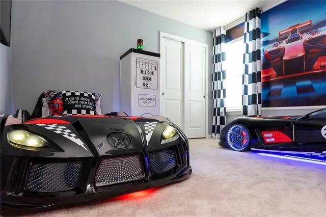 a bathroom with a granite countertop double vanity and a mirror