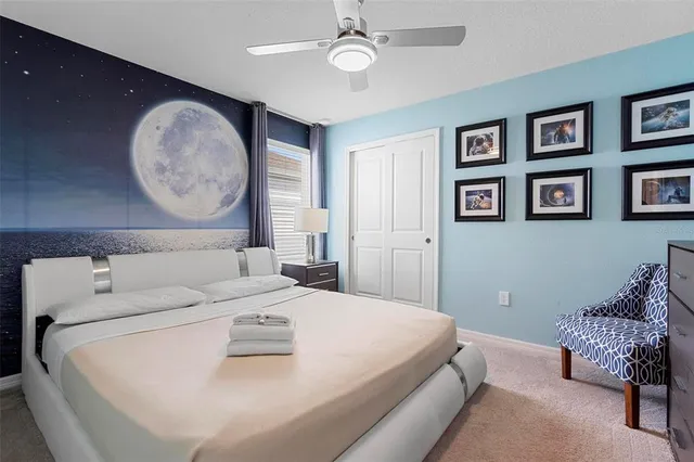 a en suite bathroom with a double vanity sink and a mirror