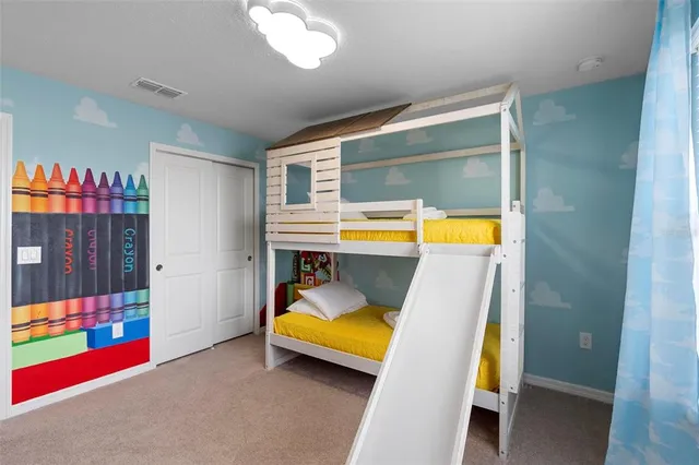 a view of a backyard with swimming pool