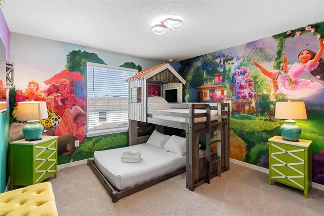 a front view of house with yard and trees in the background