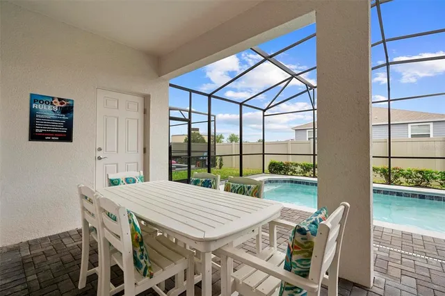 a view of swimming pool with a balcony