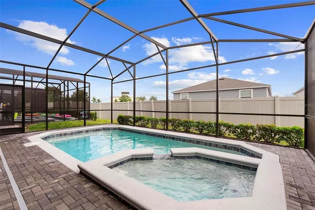 an outdoor space with patio and white umbrellas