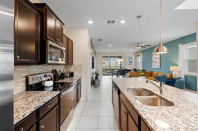 a living room with furniture potted plant and a window