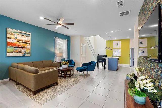 a living room with furniture and a flat screen tv