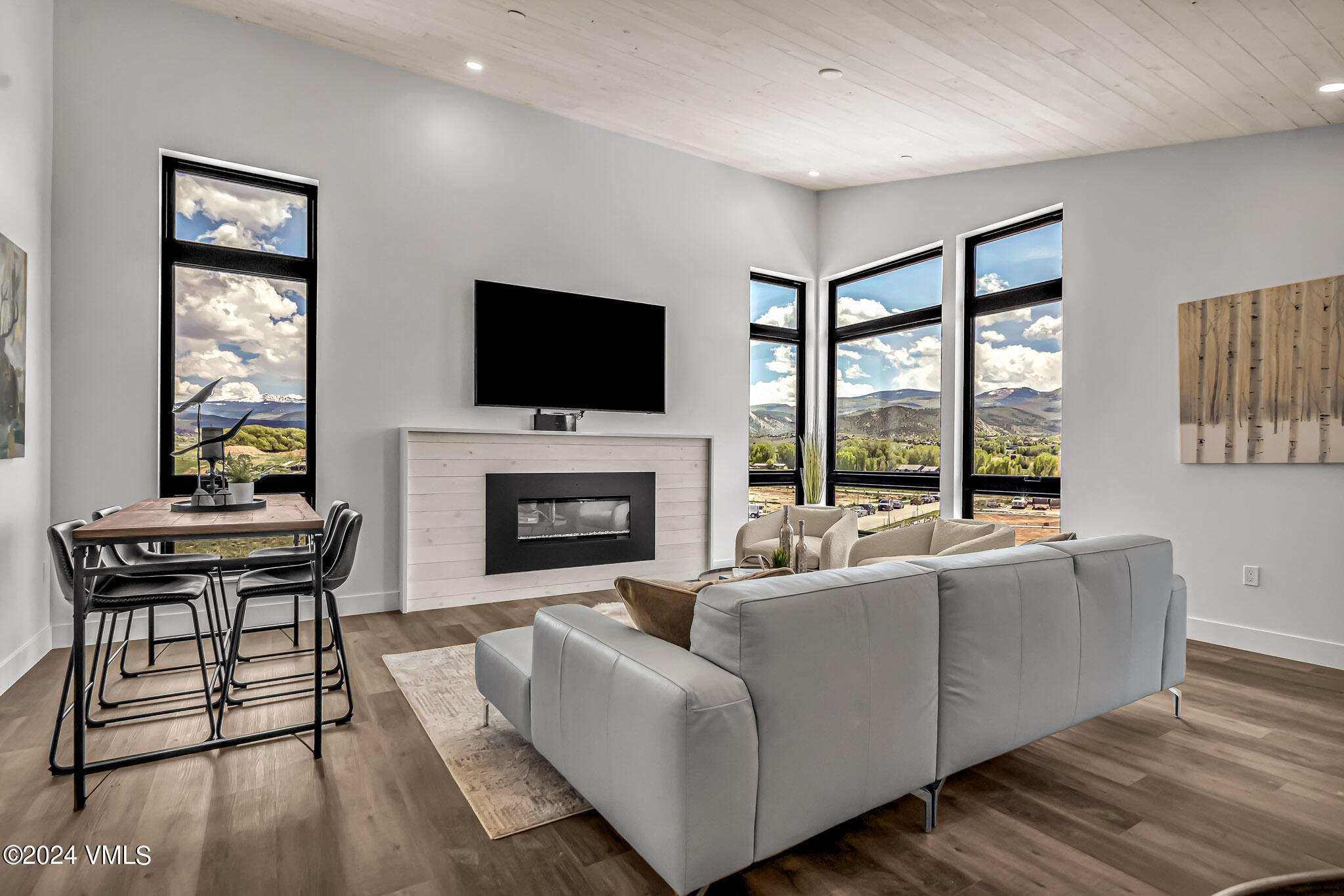 91 Mount Hope Circle, Unit A304 Eagle, CO 81631 - Photo 2 of 8 a living room with fireplace furniture and a flat screen tv